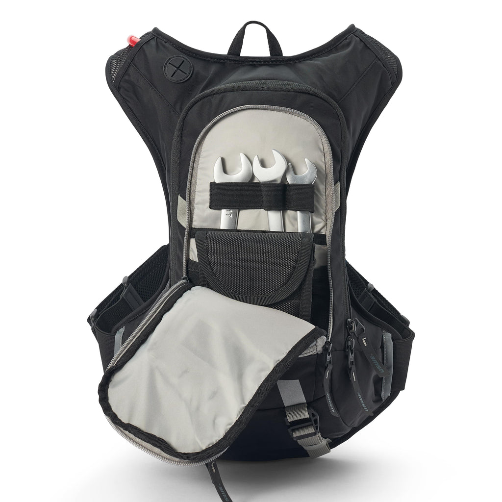Sac d’hydratation USWE Moto Hydro 12L noir pour enduro hard enduro rallye raid et adventure poche outils ouverte