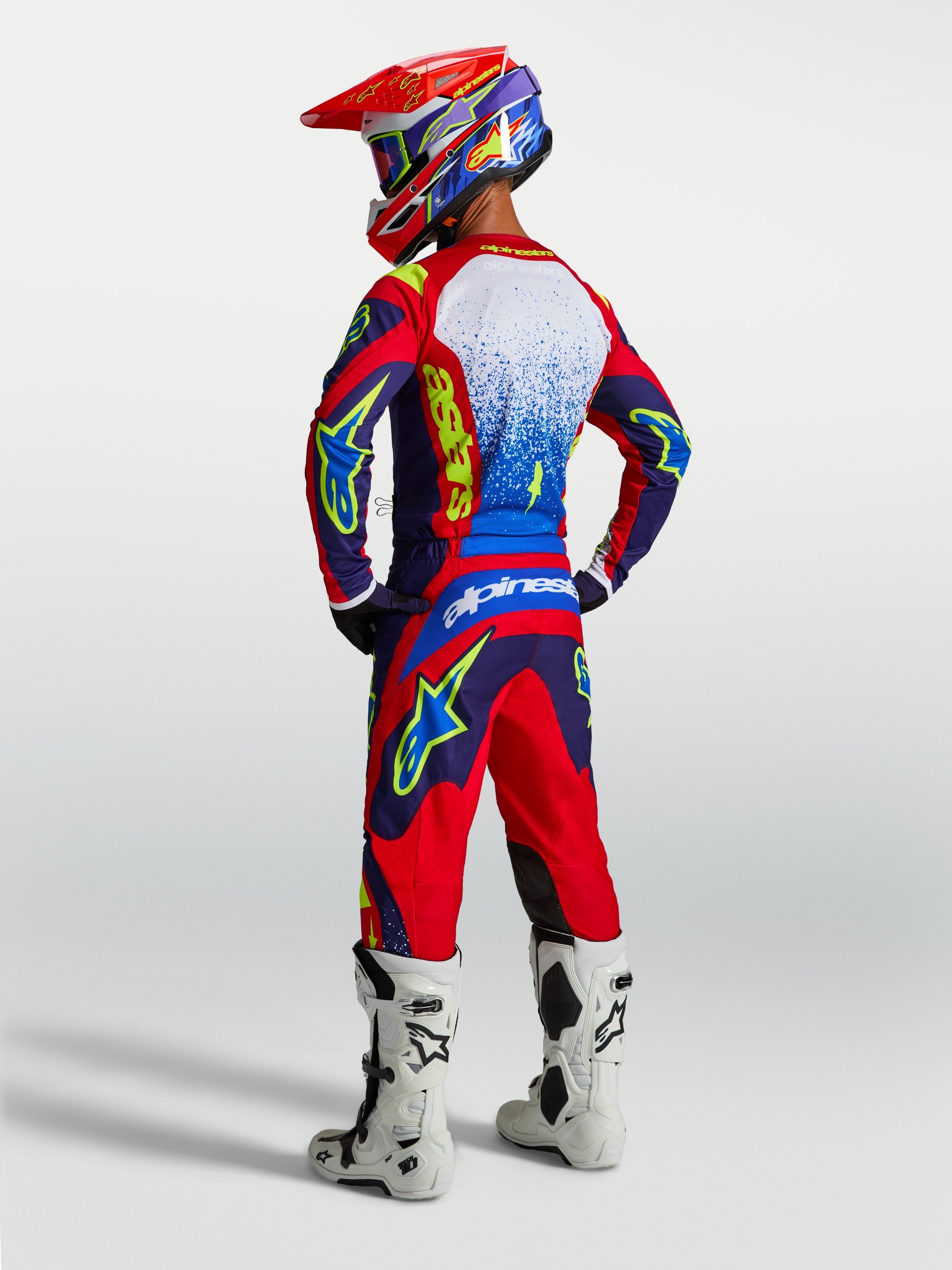 Tenue cross Alpinestars Fluid Drag bleu marine et rouge vue de dos