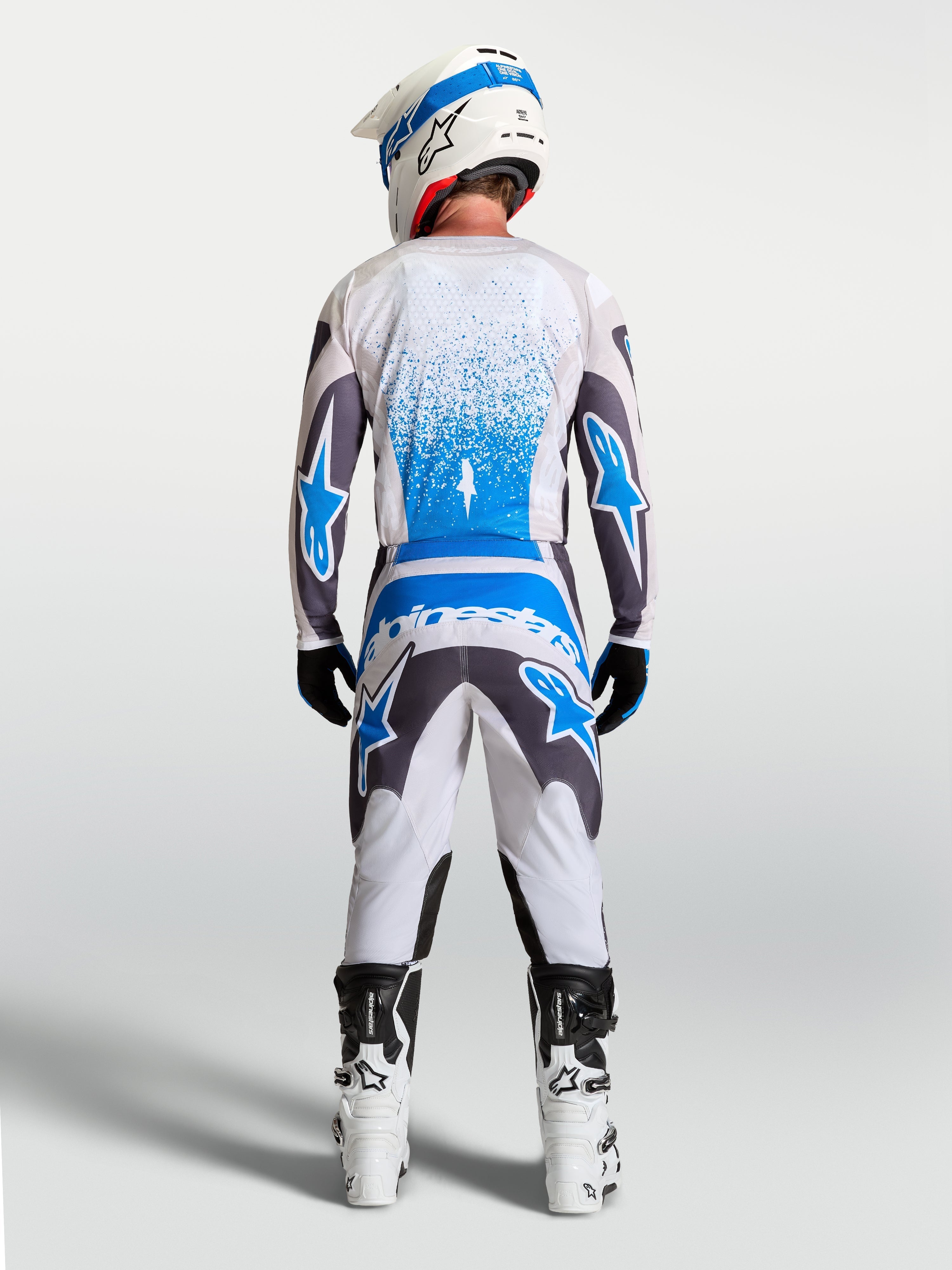 Tenue cross Alpinestars Fluid Drag gris bleu vue de profil