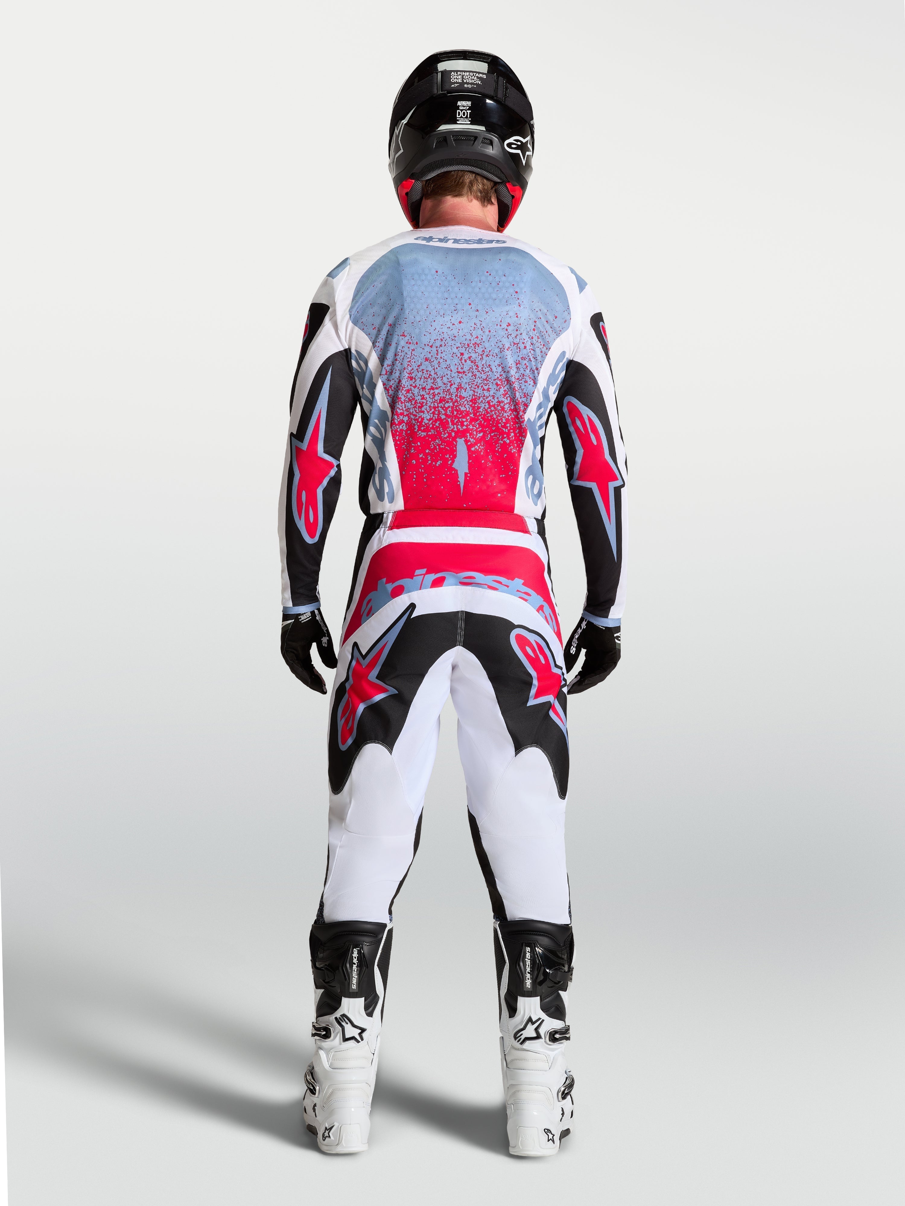 Tenue cross Alpinestars Fluid Drag blanc et rouge vue de profil