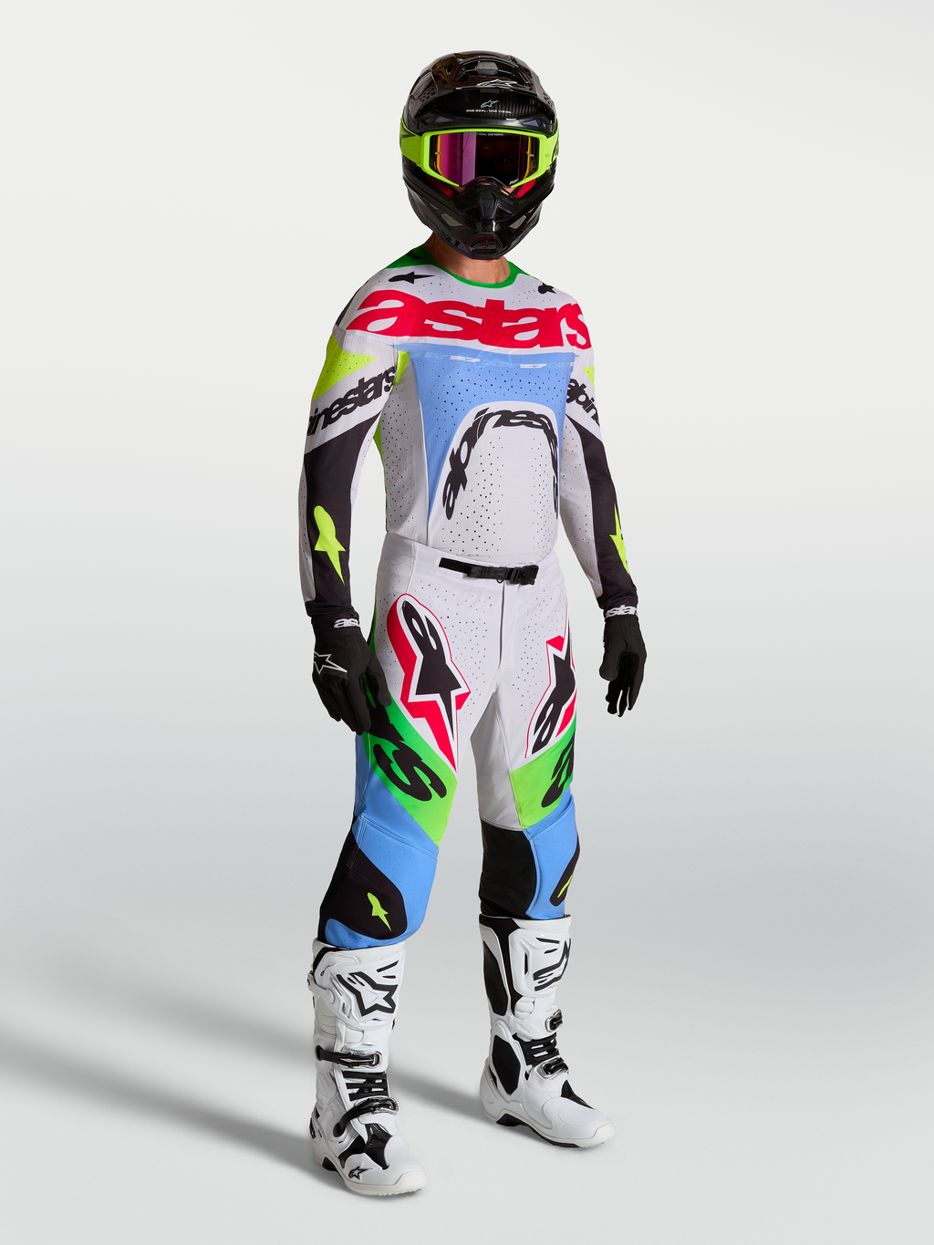 Tenue cross Alpinestars Supertech Dyna lilas et vert fluo vue de face