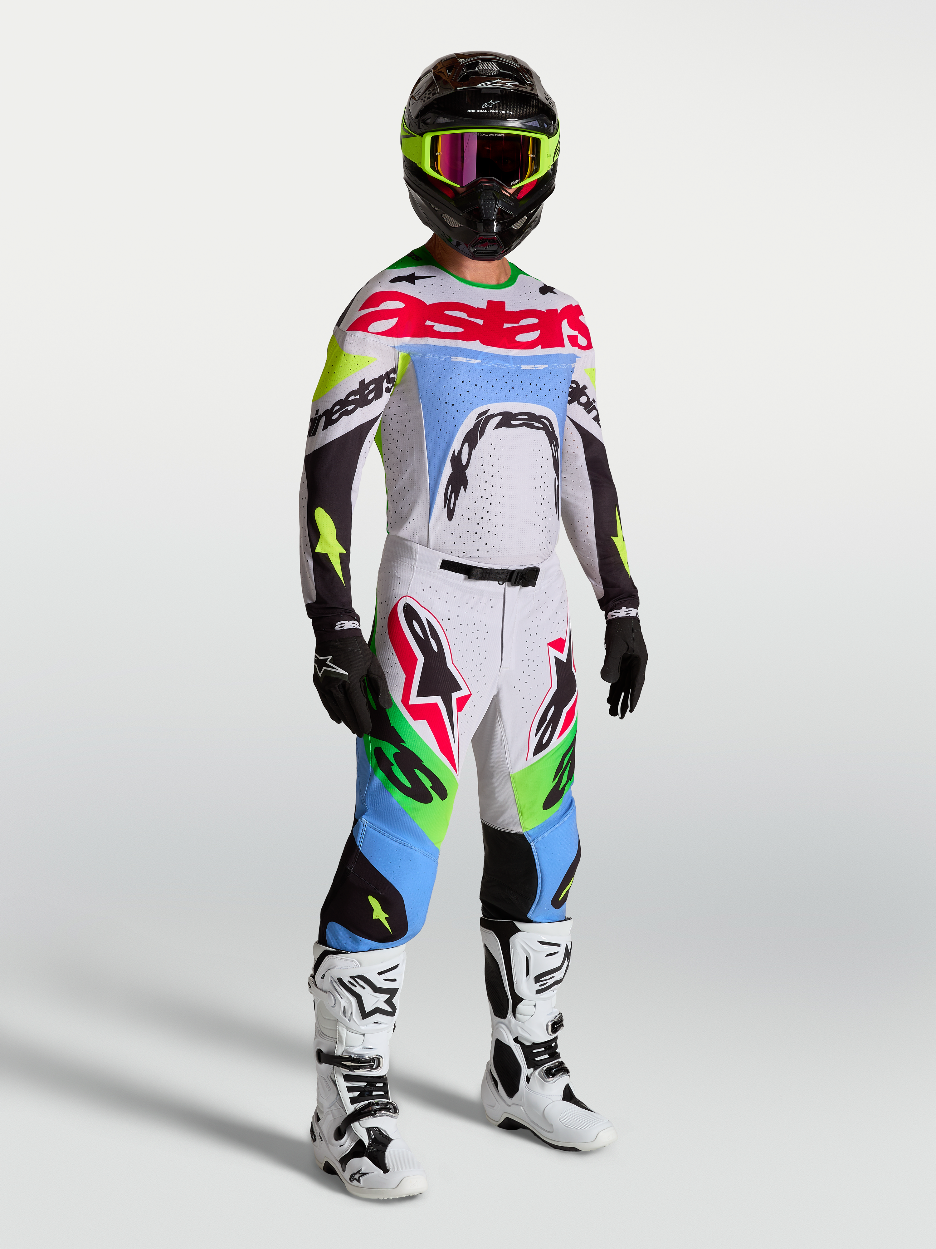 Tenue cross Alpinestars Supertech Dyna lilas et vert fluo vue de face