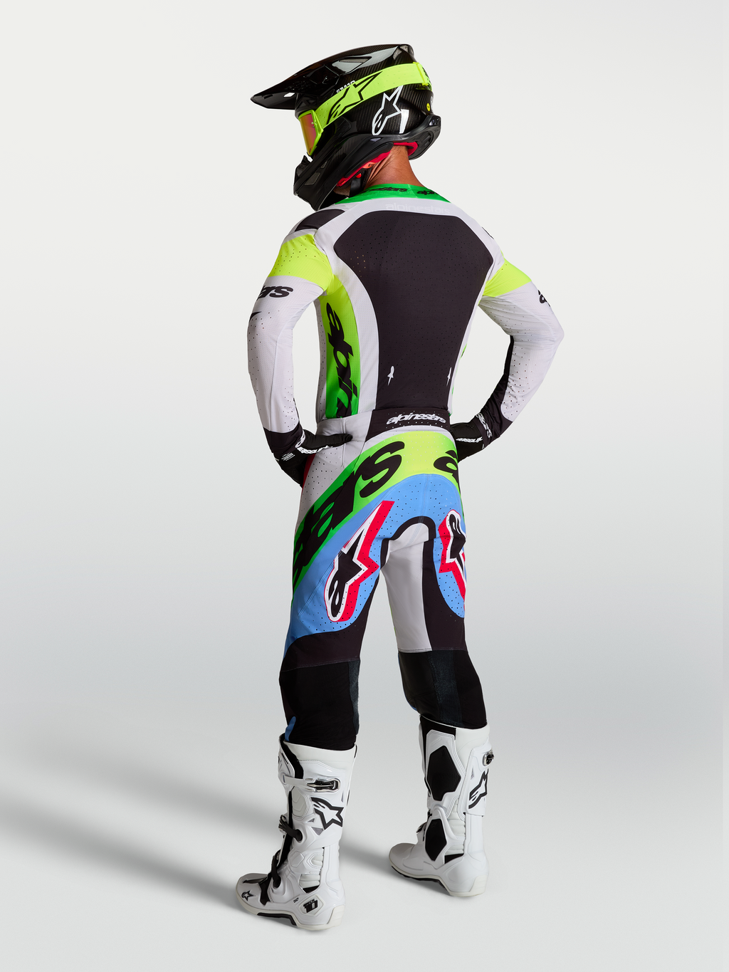 Tenue cross Alpinestars Supertech Dyna vert fluo et lilas vue de profil