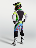 Tenue cross Alpinestars Supertech Dyna vert fluo et lilas vue de profil