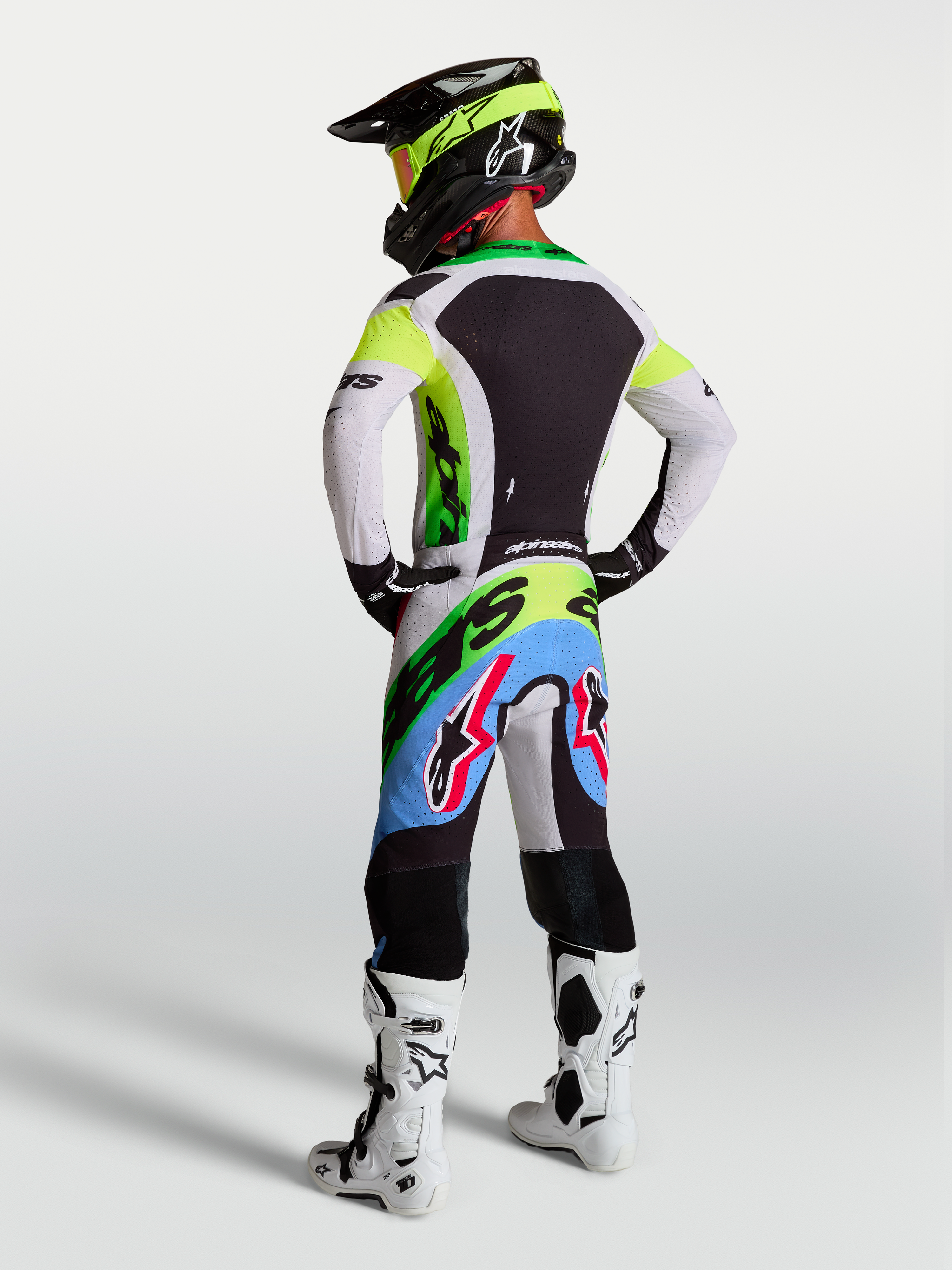 Tenue cross Alpinestars Supertech Dyna vert fluo et lilas vue de profil