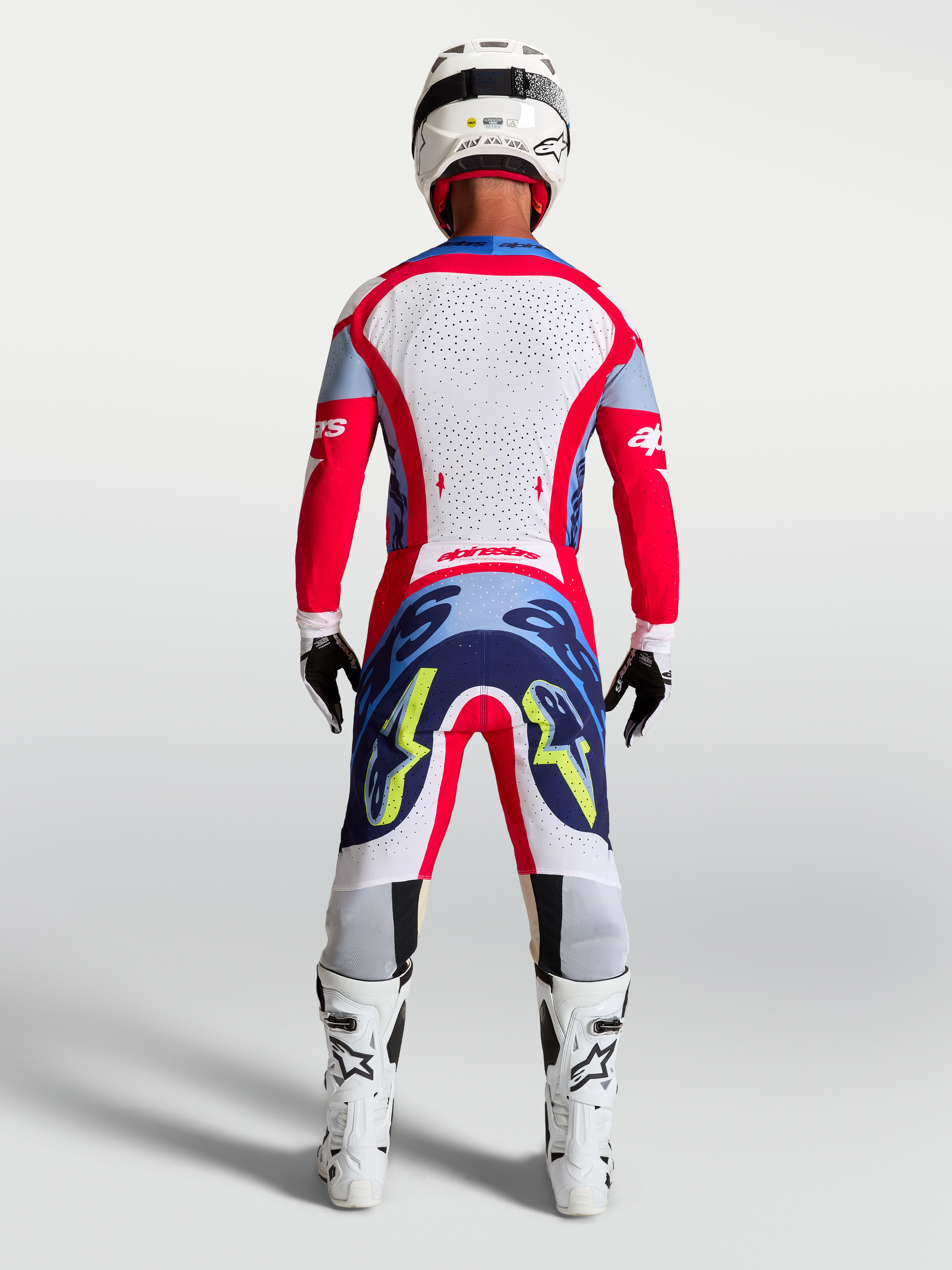 Tenue cross Alpinestars Supertech Dyna rouge et blanc vue de dos