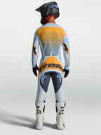 Tenue cross Alpinestars Techstar Maven bleu orange vue de dos