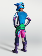Tenue cross Alpinestars Techstar Maven bleu rose vert fluo vue de profil