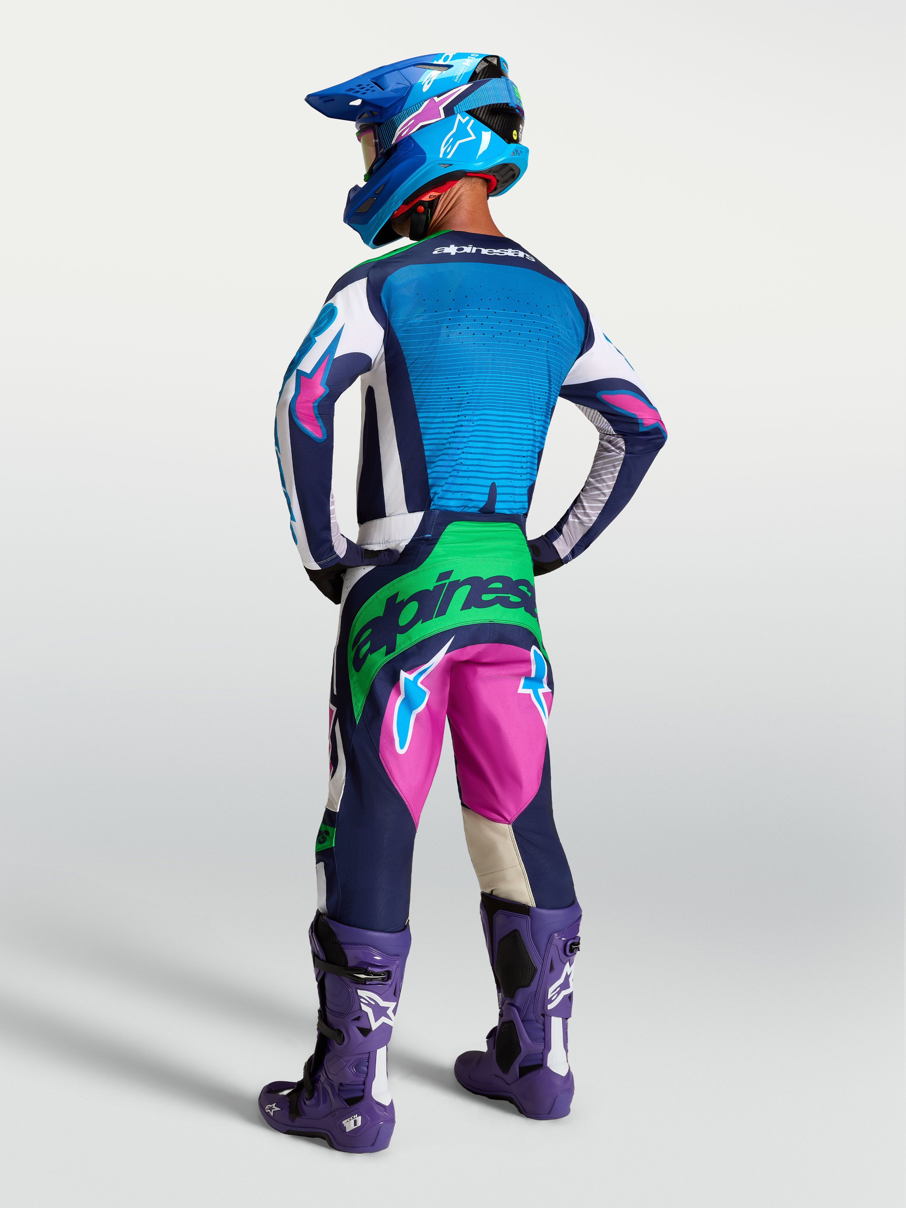 Tenue cross Alpinestars Techstar Maven bleu rose vert fluo vue de profil