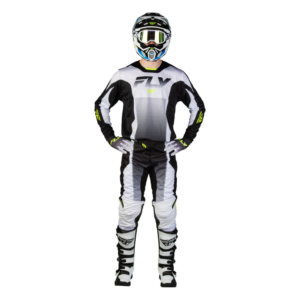 Tenue cross Fly Racing Kinetic Fade 2027 Blanc Noir Jaune fluo portée - maillot et pantalon